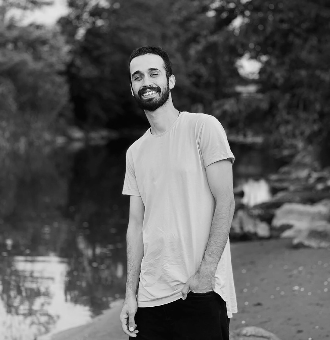 Professional portrait of a man with beard smiling